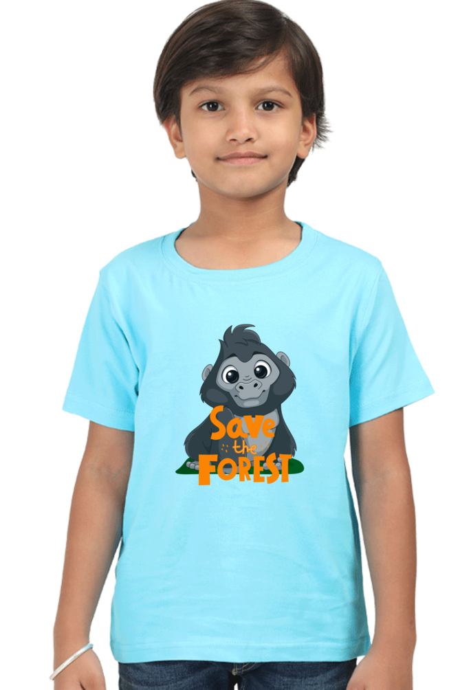 A child with short brown hair stands against a white background, wearing the light blue SAVE THE FOREST Boys T-Shirt from TuckTribe, featuring a cartoon mountain gorilla and the slogan Forest Guardian.