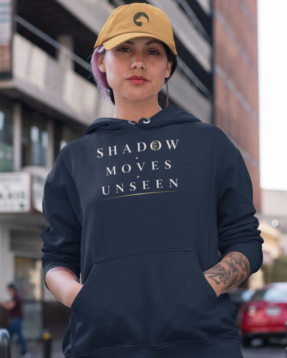woman wearing a Oversized navy unisex leopard hoodie with detailed back wildlife graphic and Shadow Moves Unseen front design