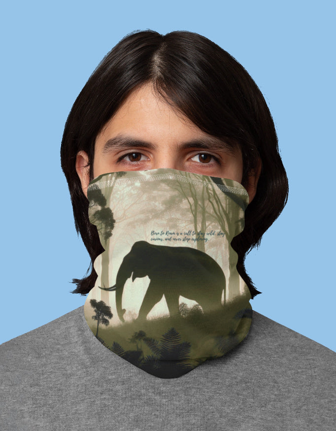 Person wearing a face mask with an elephant design on a blue background