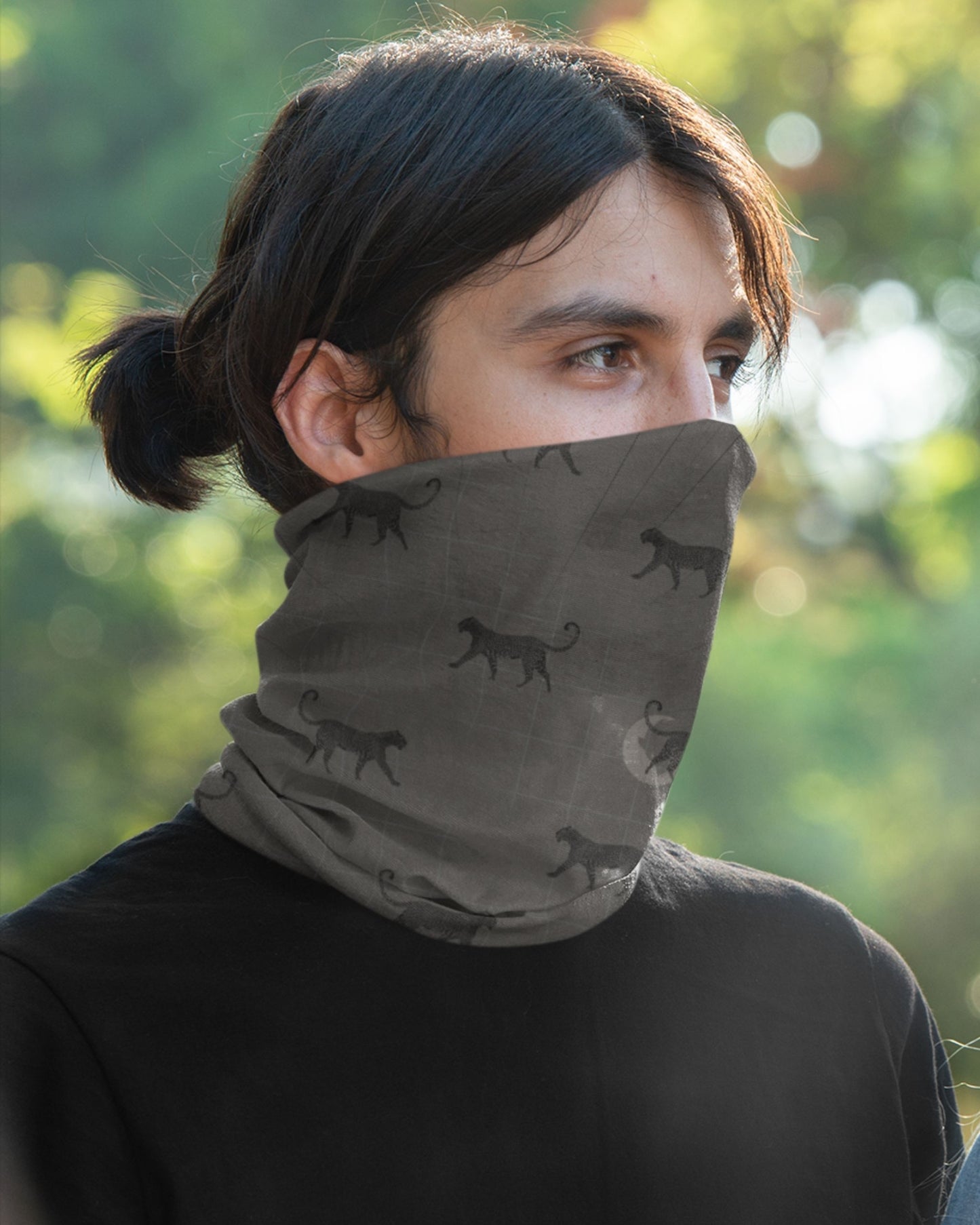 Man wearing a tucktribe silent stalker leopard neck gaiter