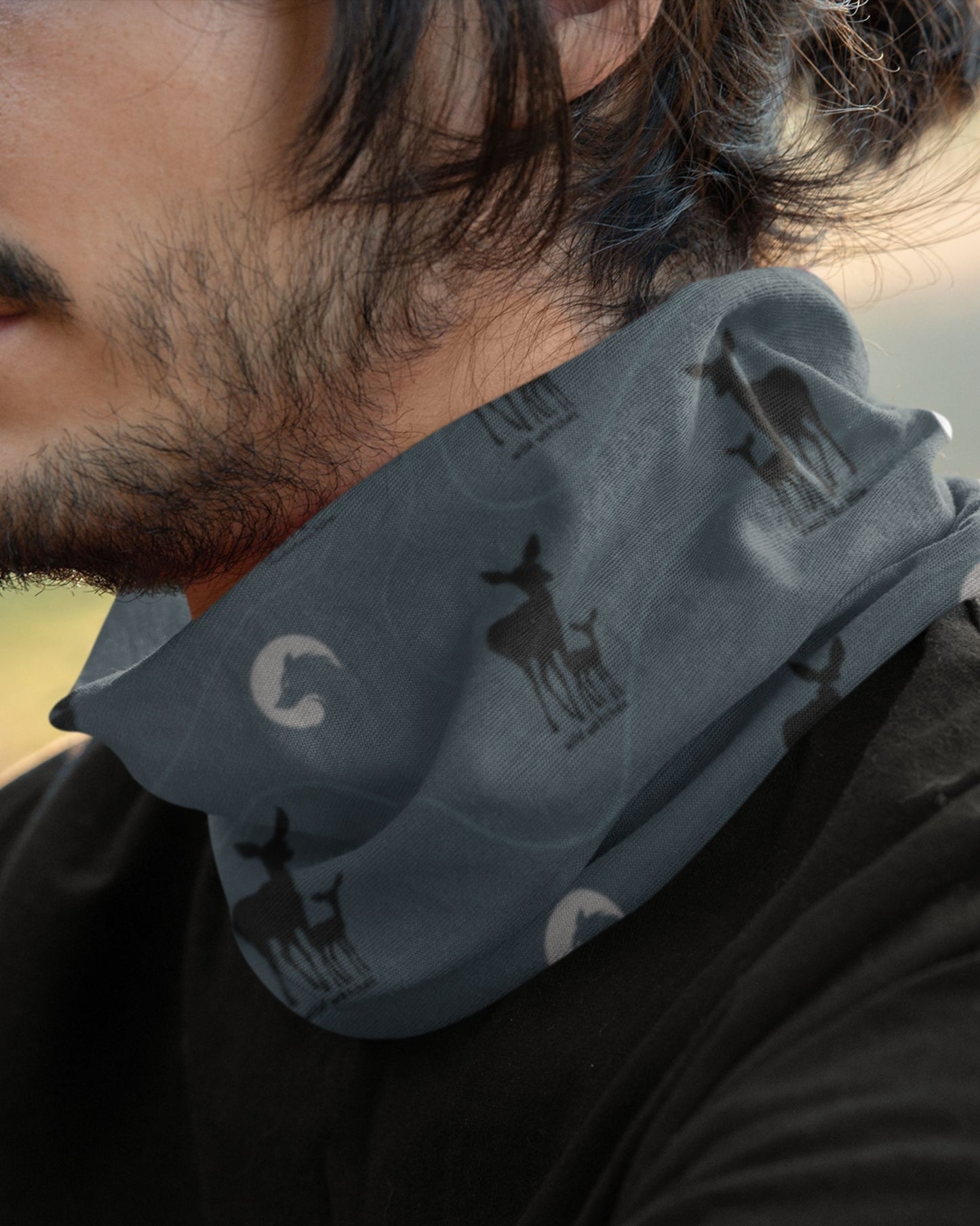 model wearing a deer wildlife outdoor buff by tucktribe around his neck