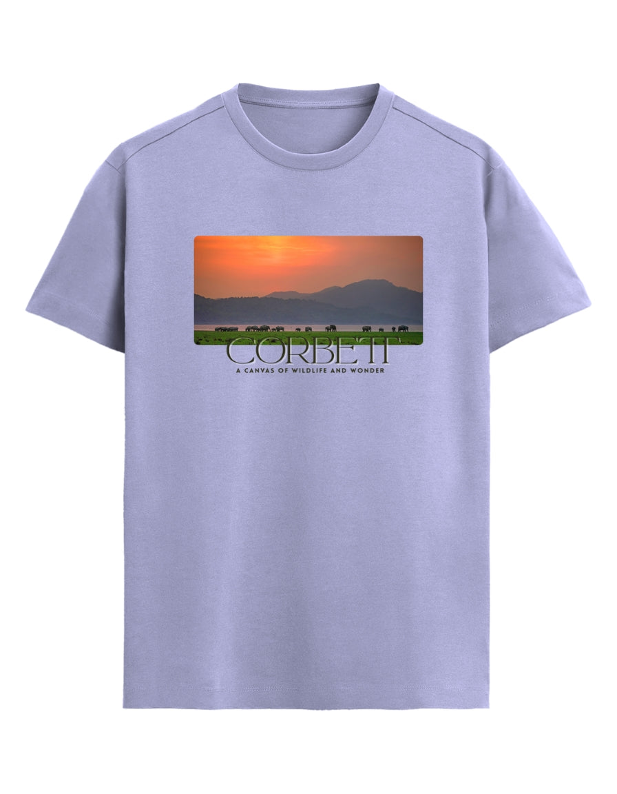 lavender t-shirt with a scenic print and 'Corbett' text on a white background