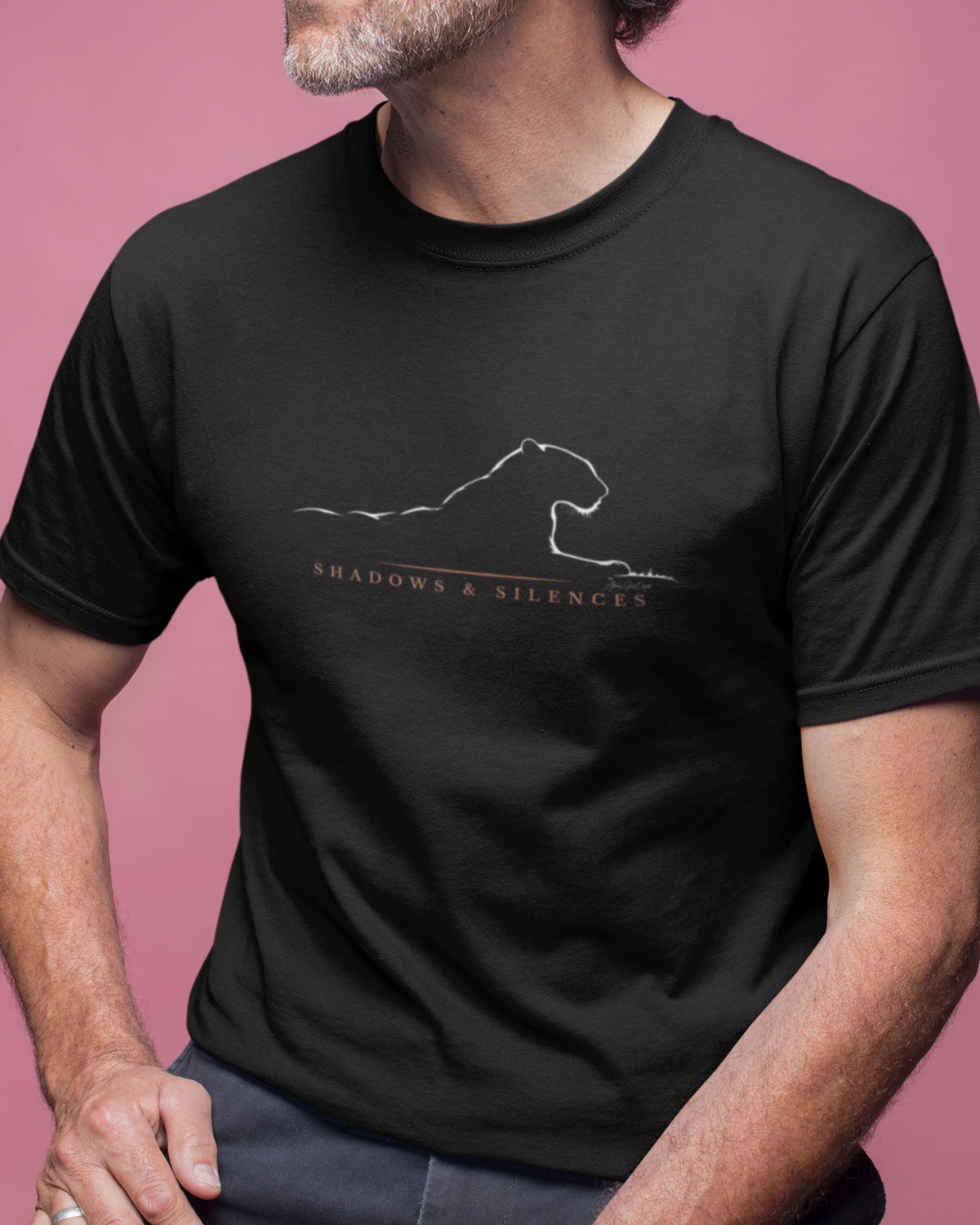 man wearing a Black Jawai leopard T-shirt with man minimalist Shadows and Silences wildlife graphic