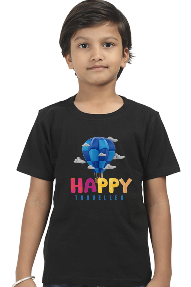 A boy models the TuckTribe HAPPY TRAVELER BOYS T-SHIRT featuring a vibrant blue hot air balloon and clouds with Happy Traveler text, perfect for inspiring adventure against a white backdrop.