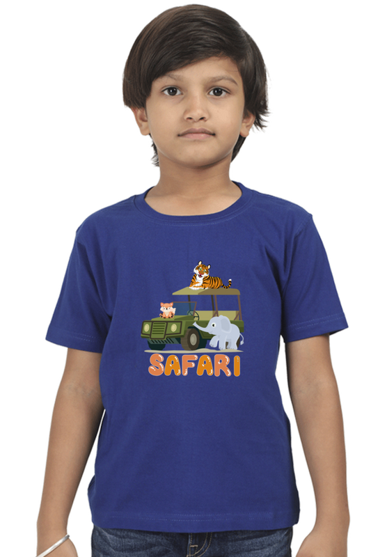 A child models a TuckTribe SAFARI ADVENTURE BOYS T-SHIRT featuring safari animals like a tiger, elephant, and giraffe on a cartoon jeep with Safari beneath the design, set against a plain white background.