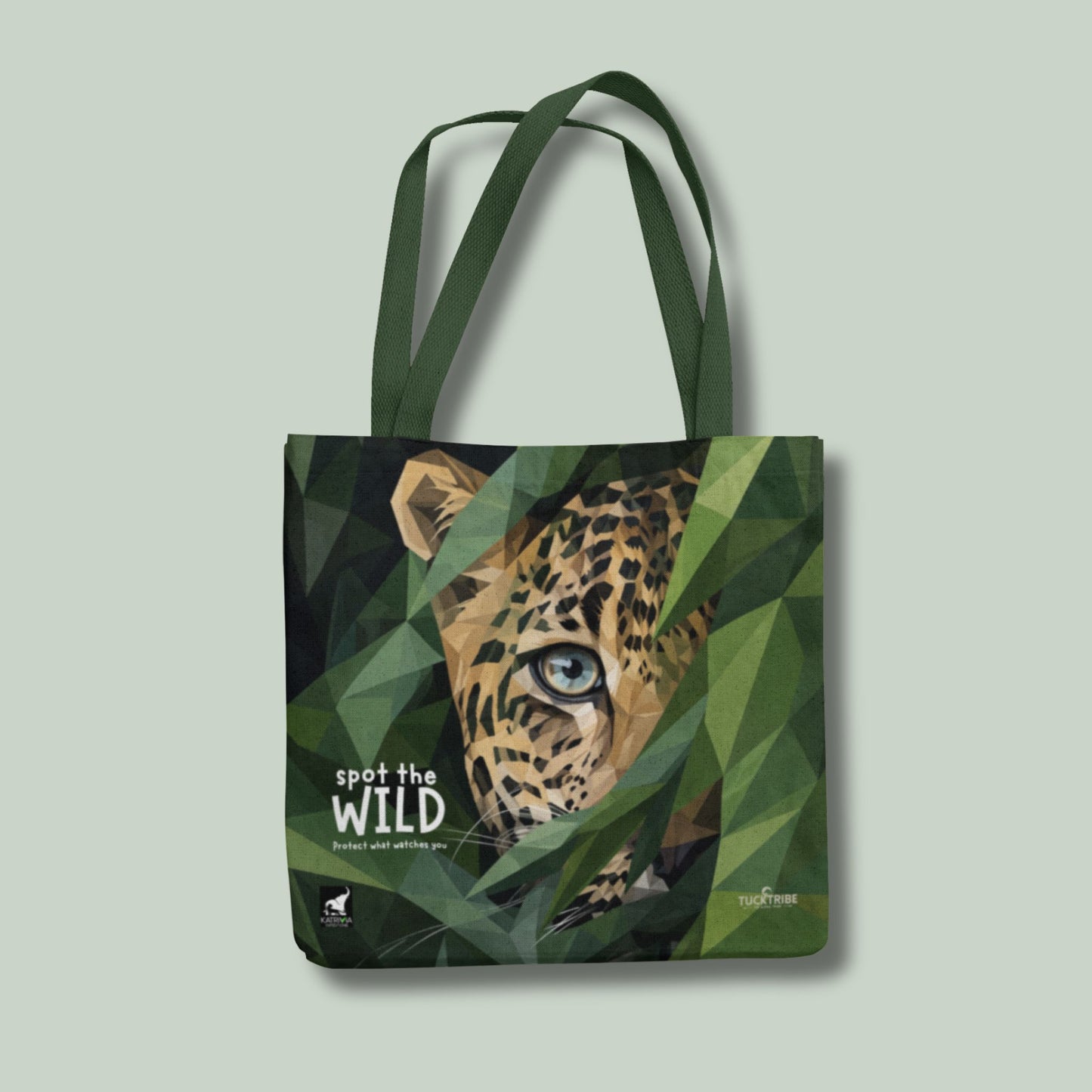 Tote bag with a leopard design and 'spot the wild' text on a green background
