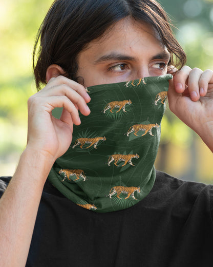 man wearing a Tiger Walk Neck Gaiter featuring walking Bengal tiger prints on a dark forest-green background by Tucktribe.
