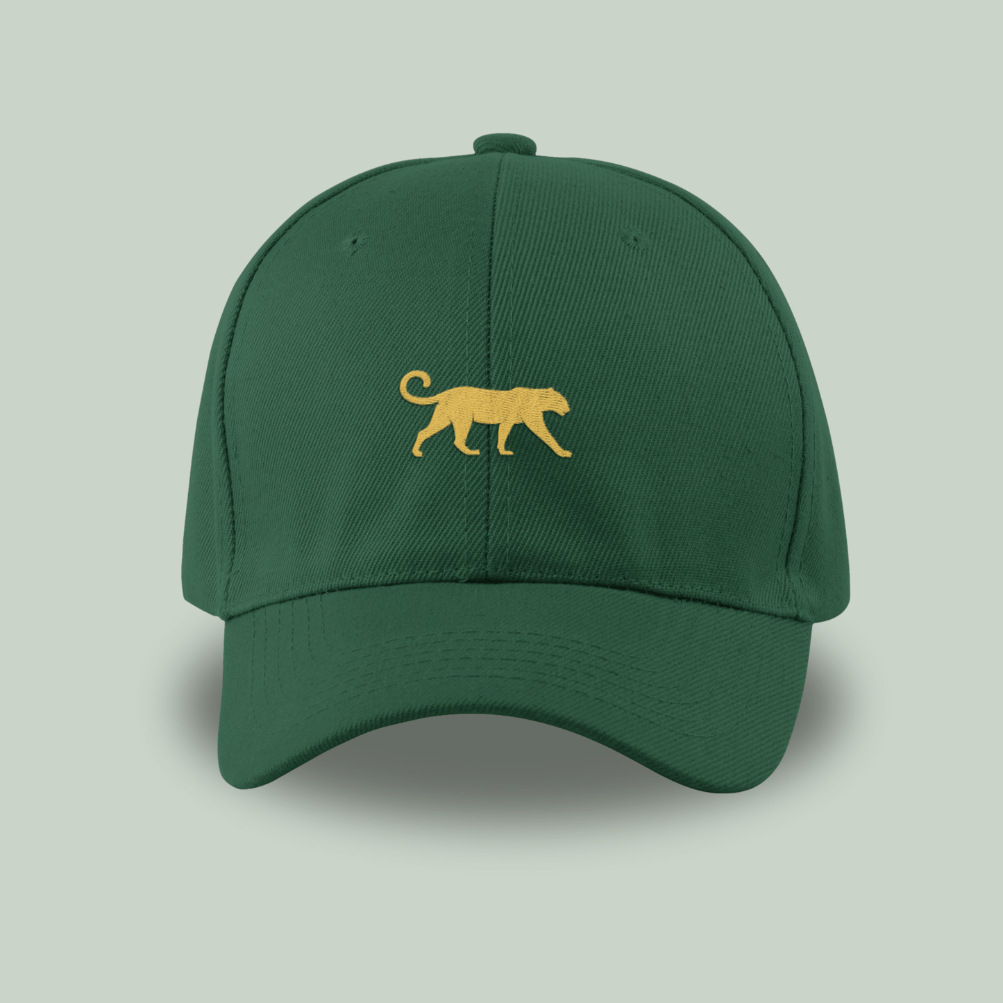 Tucktribe bottle Green cap with a gold panther logo on a light gray background
