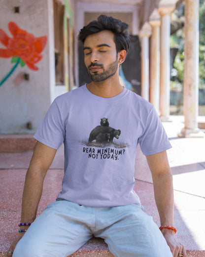 Man wearing a t-shirt with a bear graphic and text, sitting outdoors.