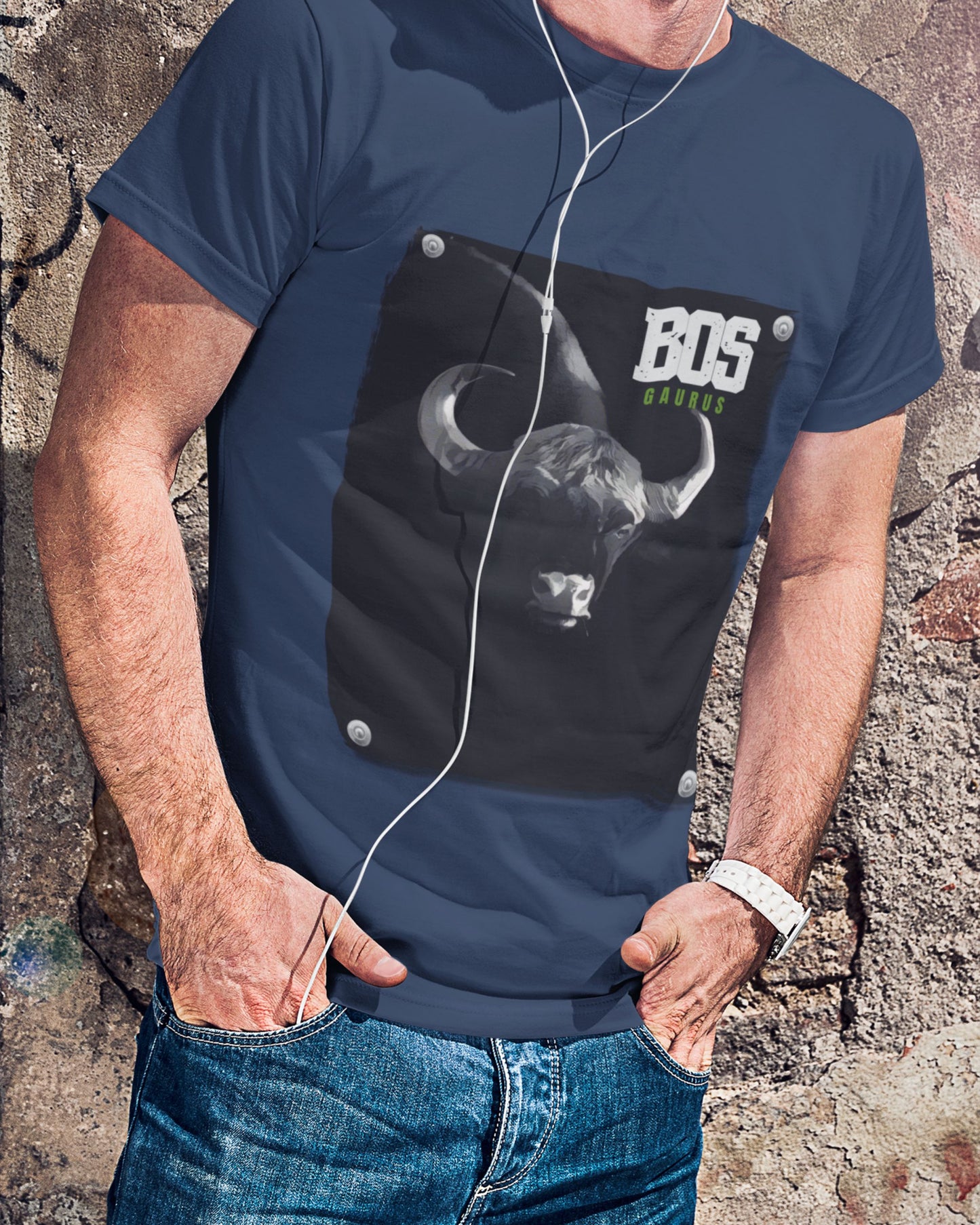 Person wearing a navy blue t-shirt with a graphic design and 'BOS' text against a textured wall.