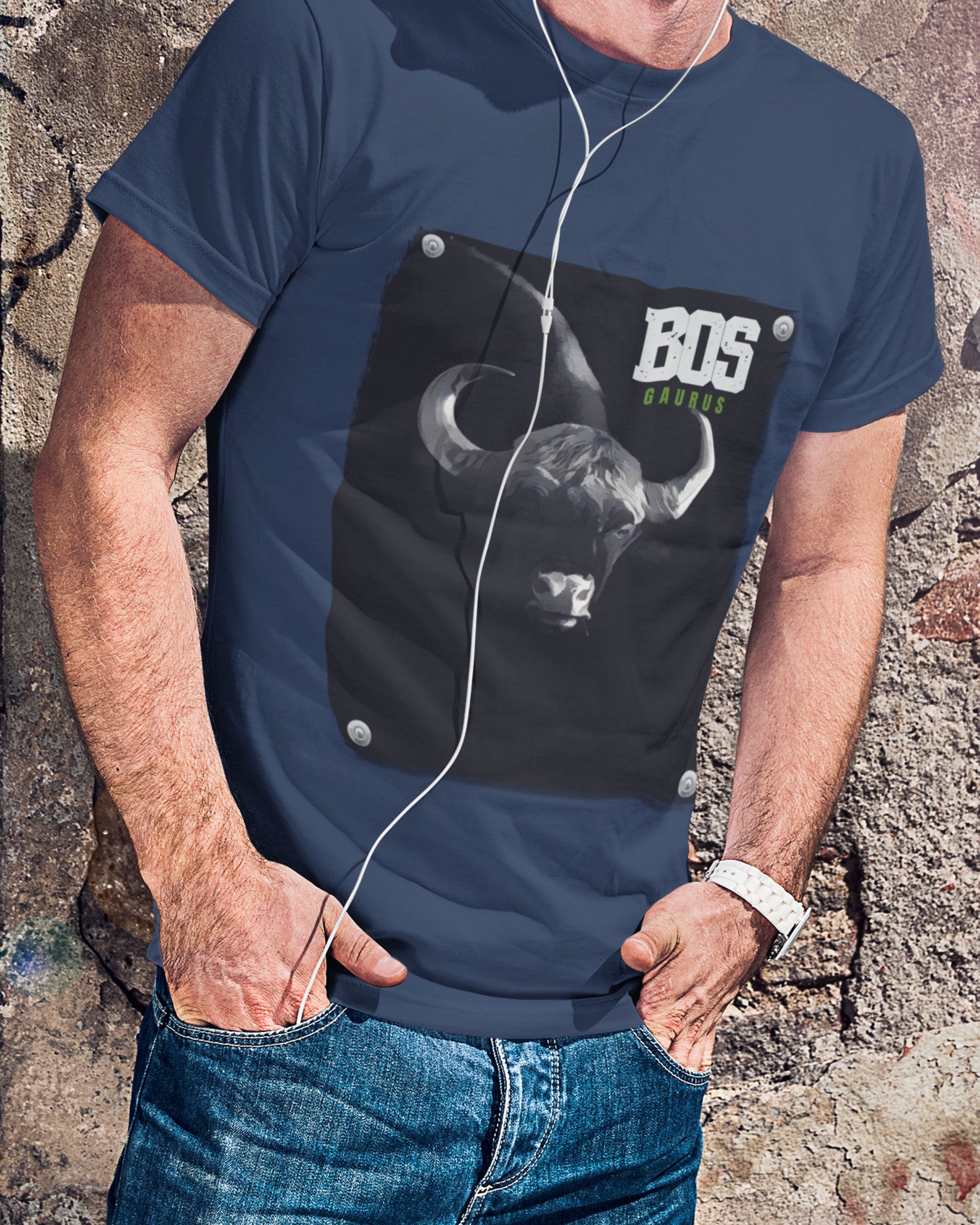 Person wearing a navy blue t-shirt with a graphic design and 'BOS' text against a textured wall.