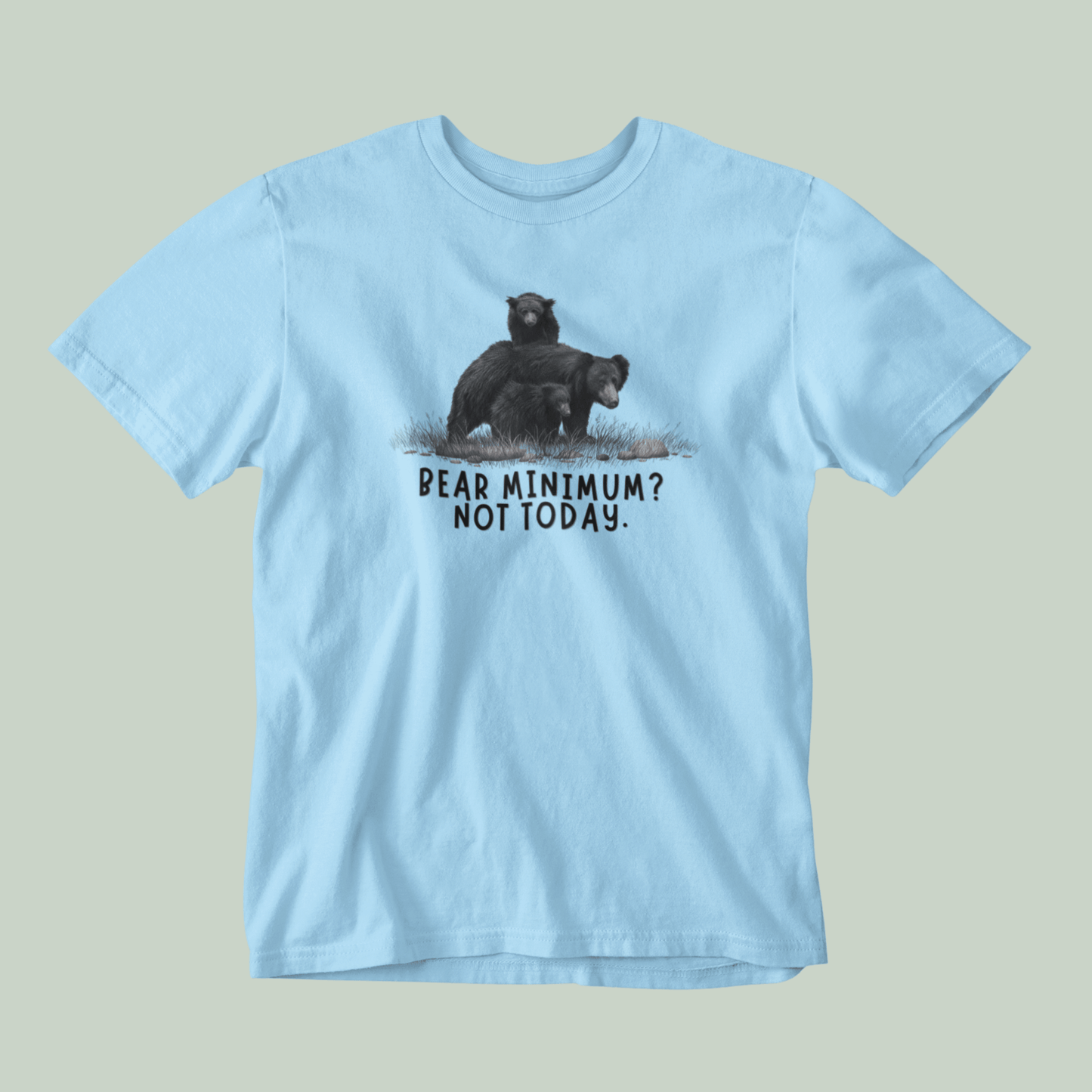 Light blue t-shirt with bear graphic and text on a gray background