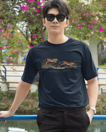 man wearing a navy blue  Tucktribe Fables of Stripes unisex tiger graphic T-shirt