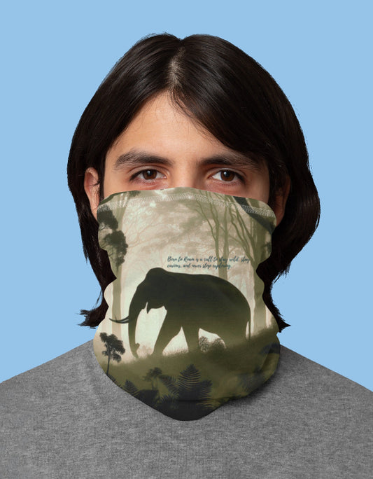 Person wearing a face mask with an elephant design on a blue background