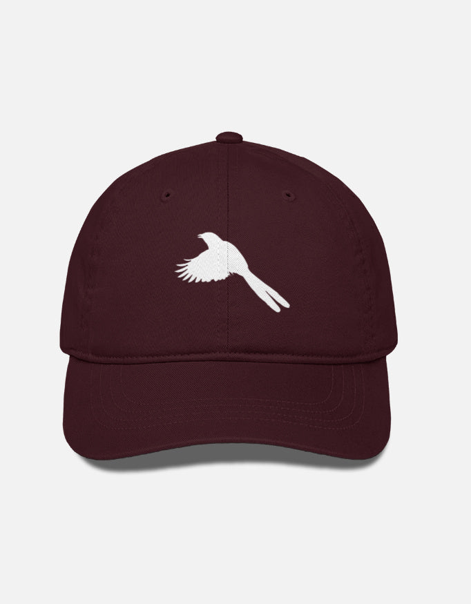 Maroon cap with a white bird design on a light gray background