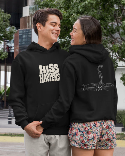 Black unisex hoodie featuring Hiss Happens typography on the front with detailed cobra snake artwork on the back for wildlife lovers.