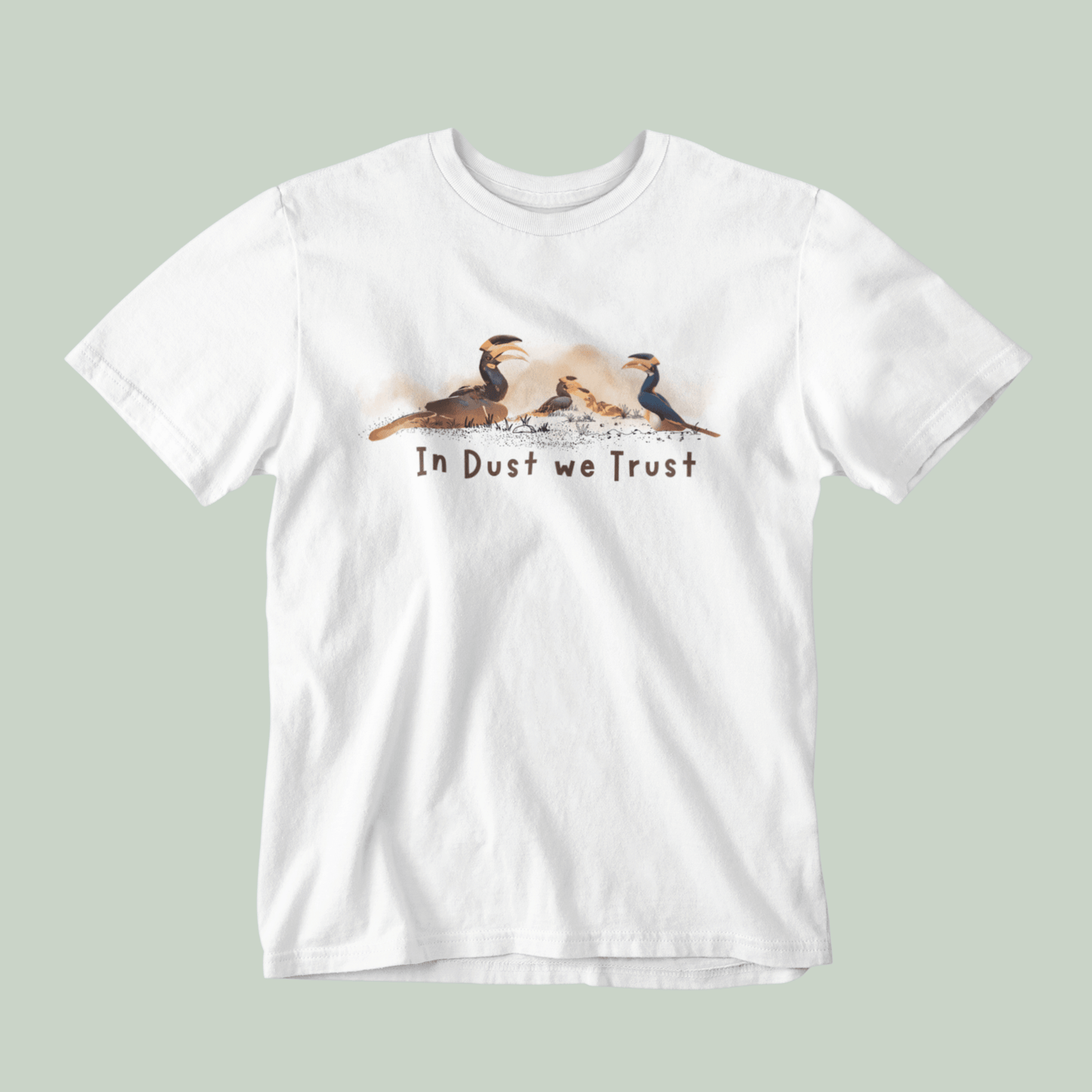 White t-shirt with a graphic of three birds and 'In Dust We Trust' text on a light green background