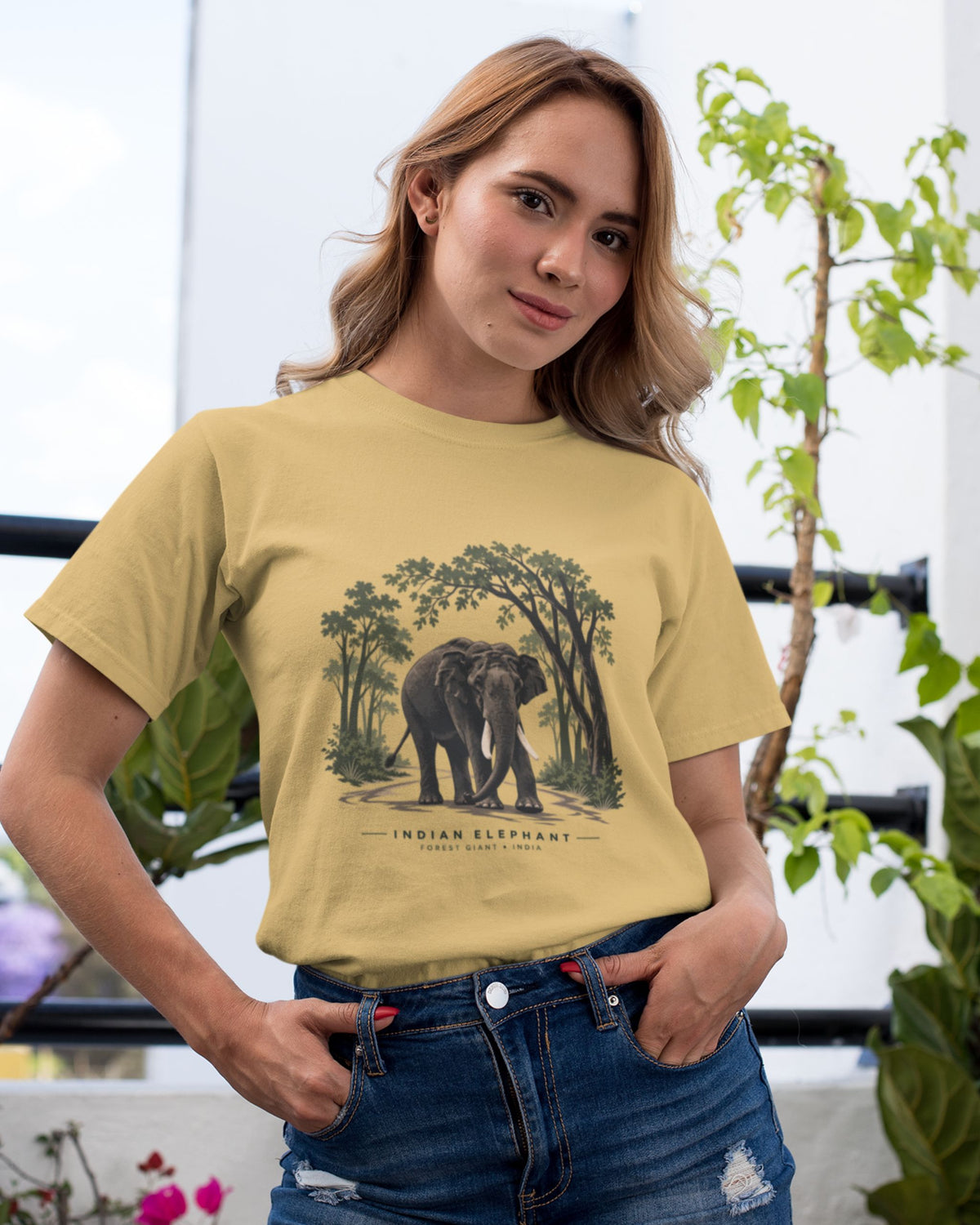 woman wearing a beige Indian elephant tusker T-shirt inspired by Kabini wildlife