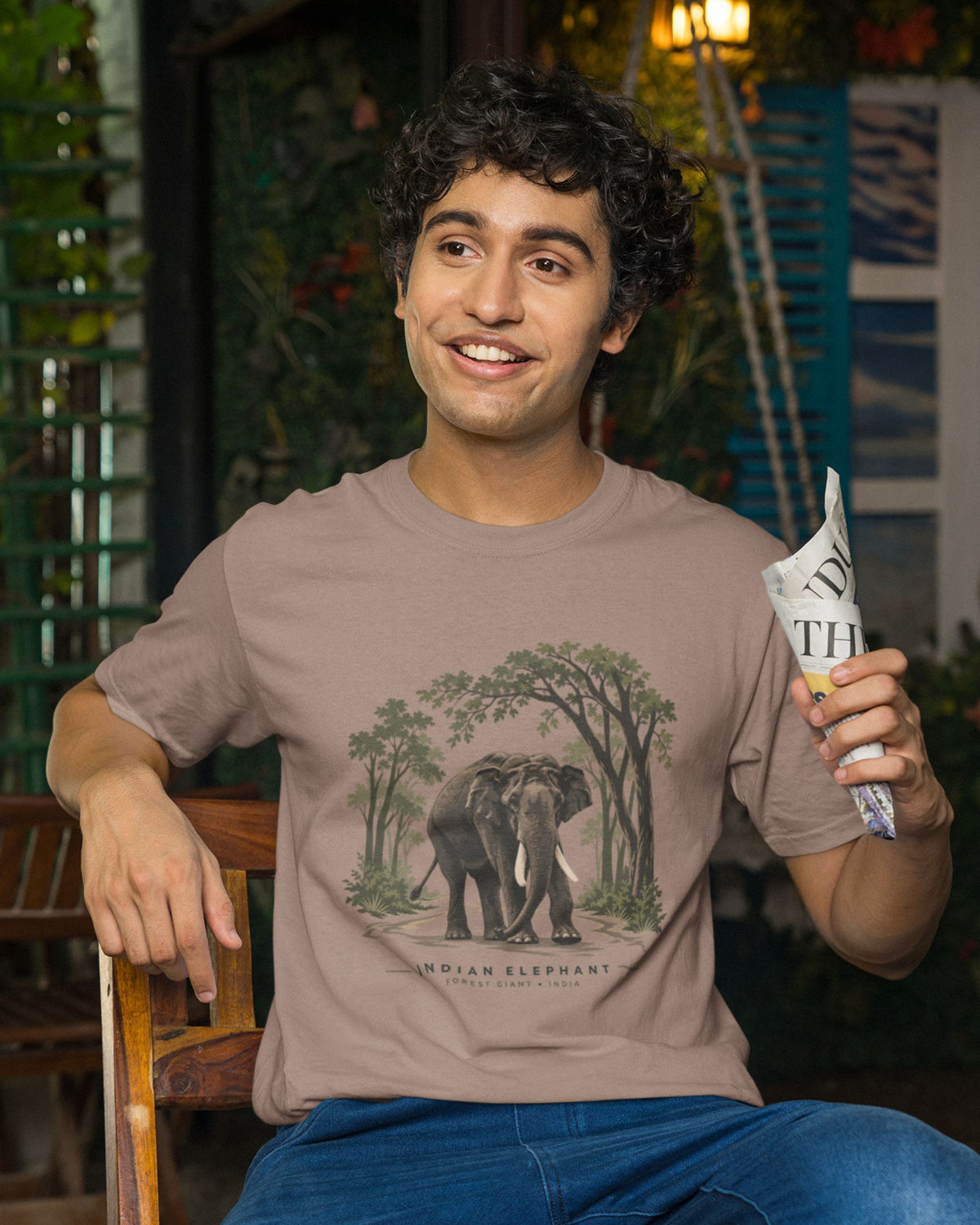 man wearing a sandalwood dust color Indian elephant tusker T-shirt inspired by Kabini wildlife