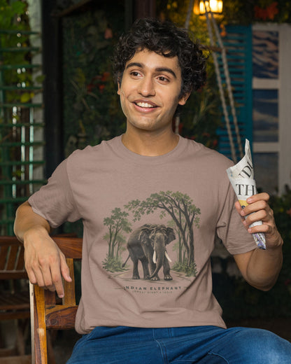 man wearing a sandalwood dust color Indian elephant tusker T-shirt inspired by Kabini wildlife