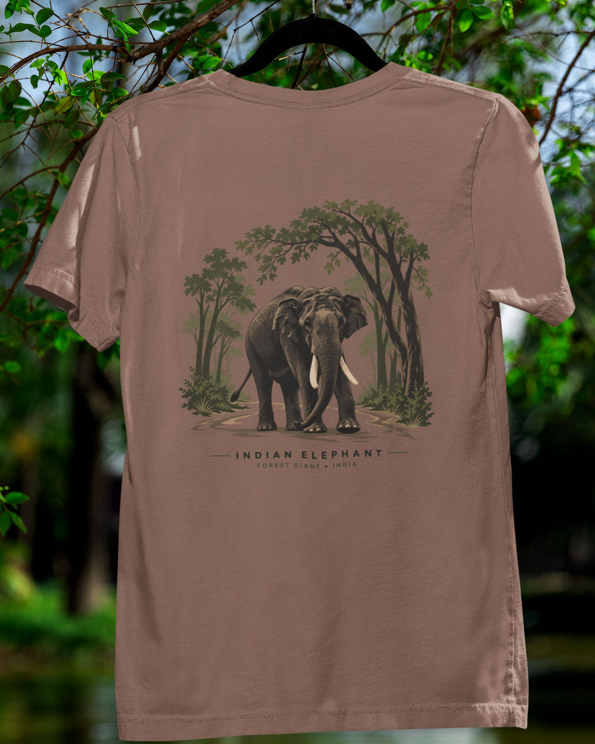 sandalwood dust color Indian elephant tusker T-shirt on a hanger suspeneded on a tree inspired by Kabini wildlife