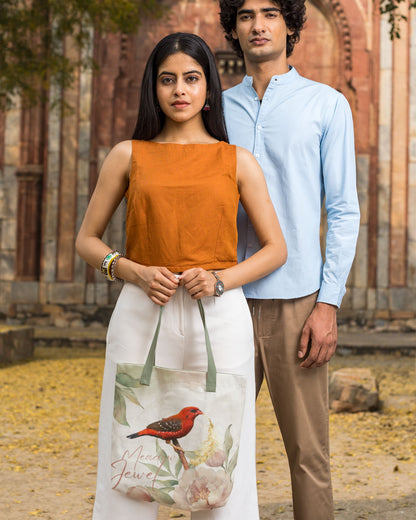 Two people standing outdoors with a scenic background