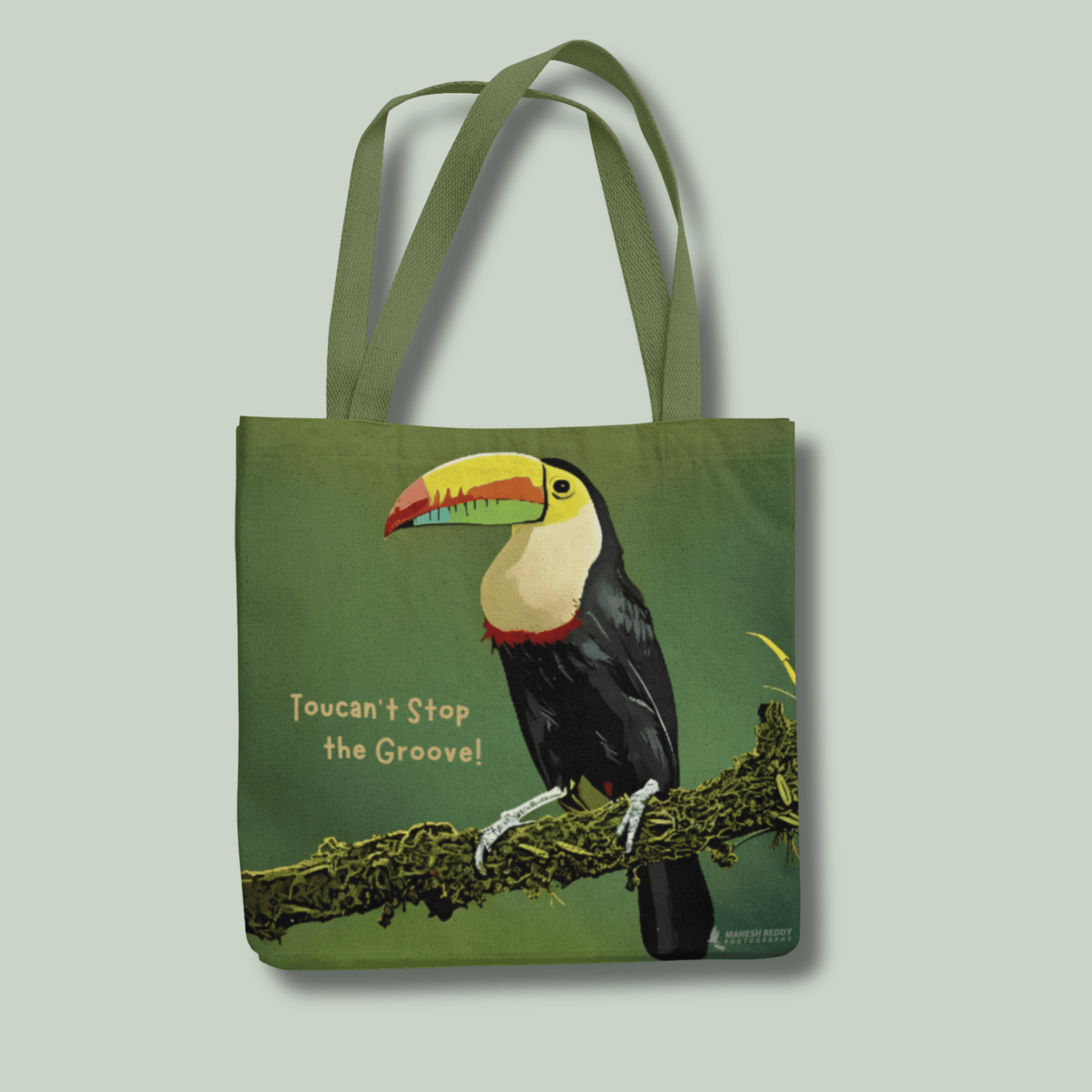 Tote bag with a toucan design and text on a light gray background
