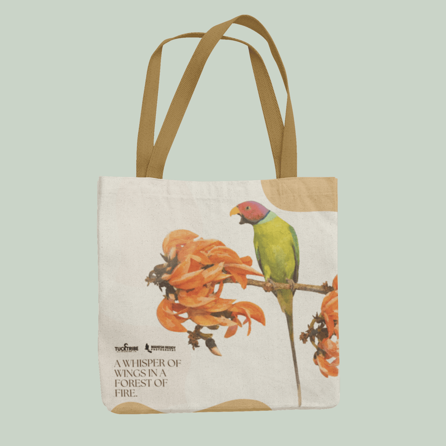 Tucktribe Tote bag with a Rose ringed parrakeet design on a light green background