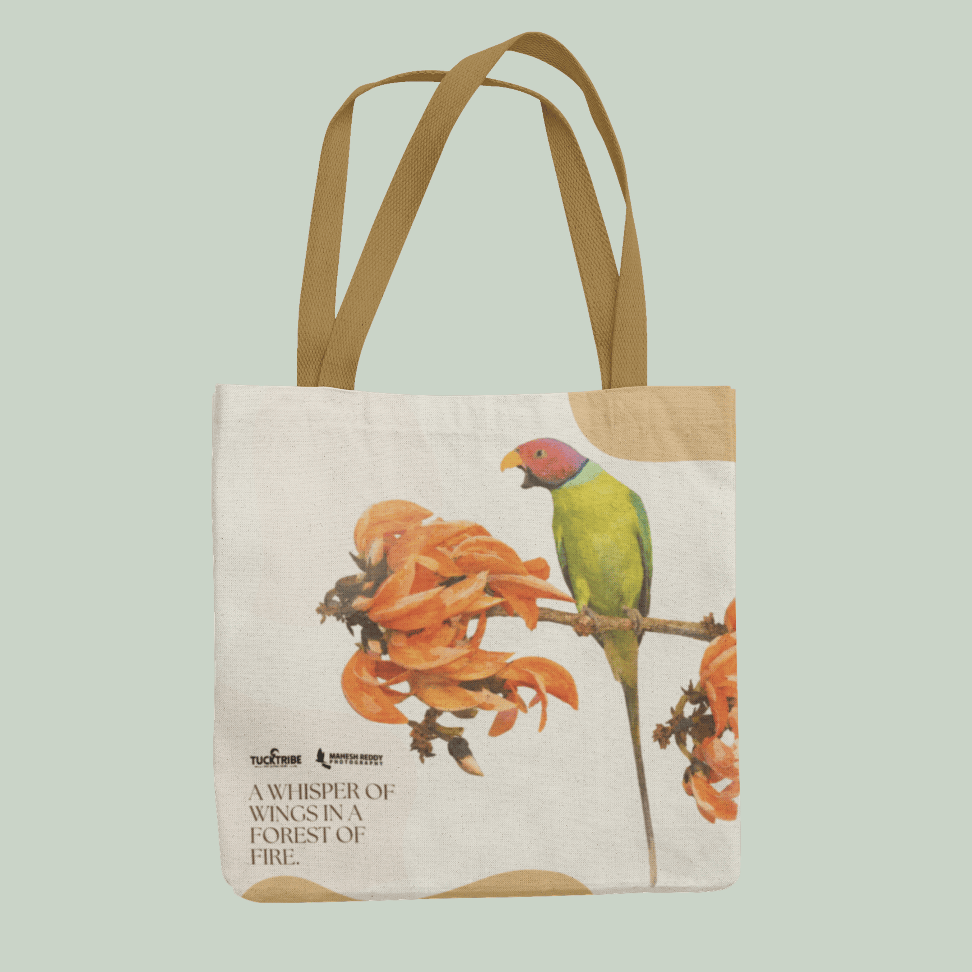 Tucktribe Tote bag with a Rose ringed parrakeet design on a light green background