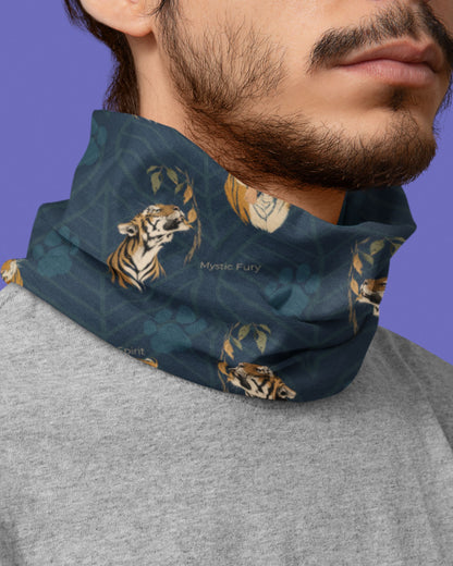 A close-up of a man wearing a dark teal neck gaiter with a tiger and leaf pattern, paired with a gray t-shirt against a solid purple background.