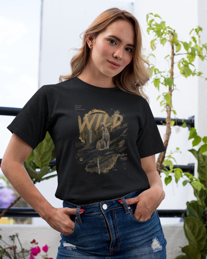 Woman wearing a black tucktribe t-shirt with a leopard graphic design outdoors