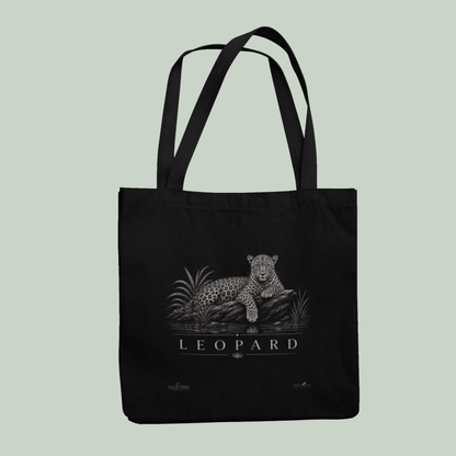 Black Tucktribe leopard wildlife tote bag featuring a detailed leopard illustration inspired by wildlife photography