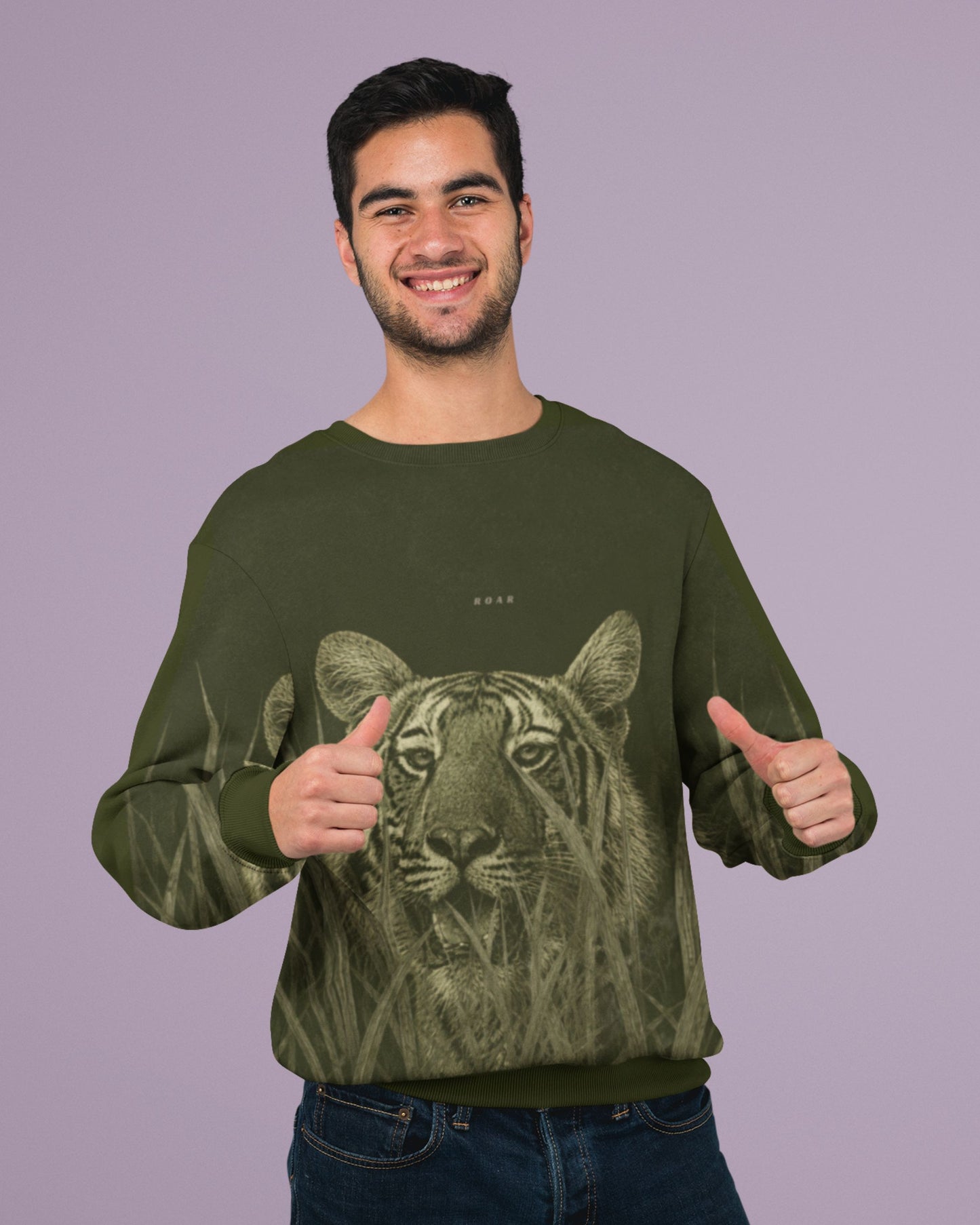 Man wearing a Premium Bengal tiger emerging through tall grass on a wildlife-inspired unisex sweatshirt 