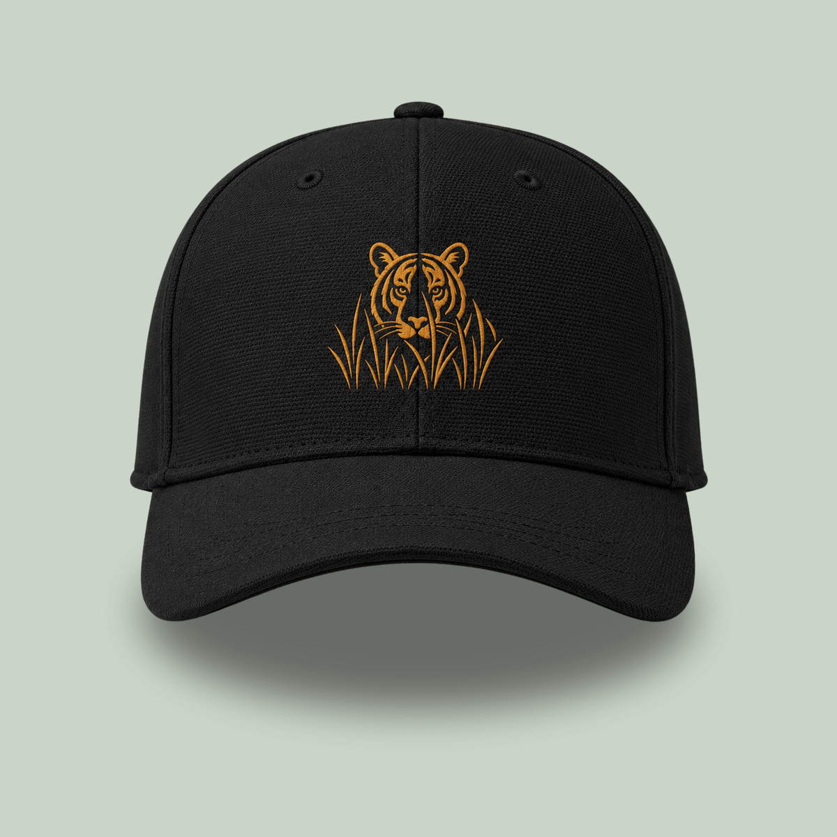 Front view of Black Ottoman cap with golden embroidered stalking tiger emerging through grass