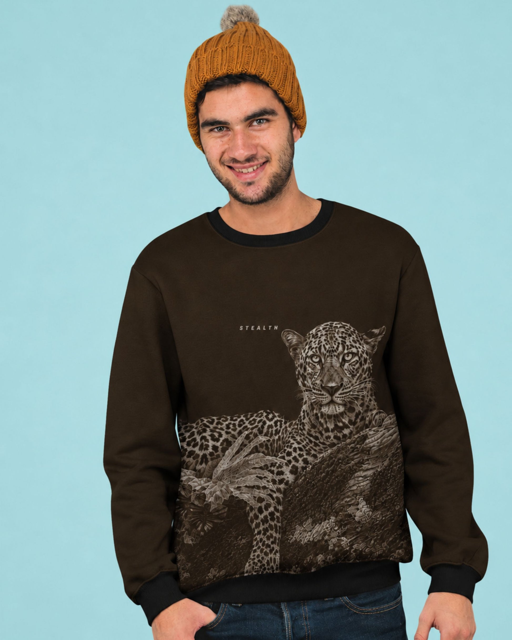 Man wearing a detailed leopard resting on a tree wildlife artwork featured on a premium unisex sweatshirt by tucktribe.