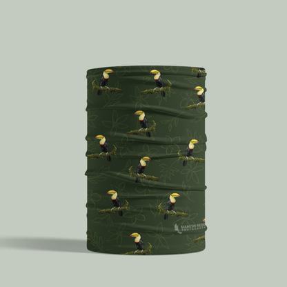 Green Tucktribe neck gaiter with toucan pattern on a light gray background