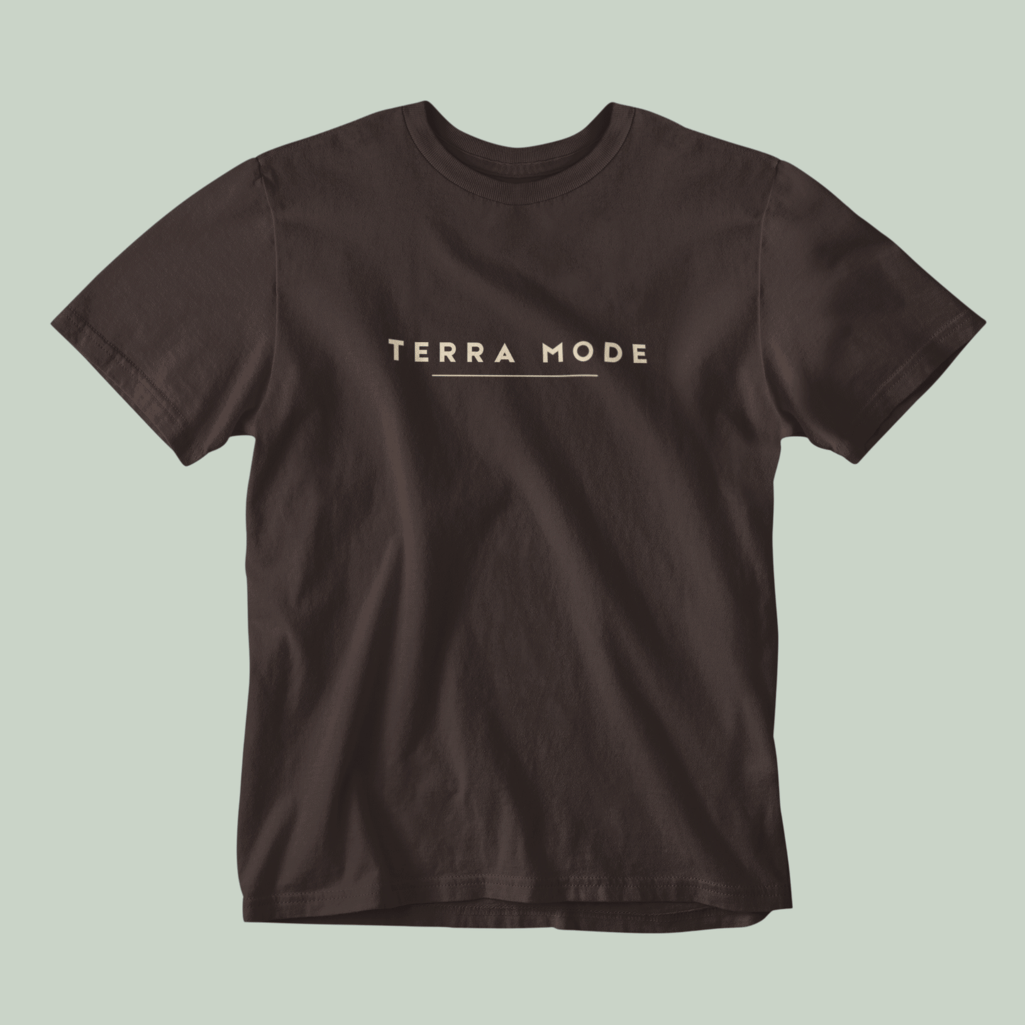 Tucktribe Brown t-shirt with 'Terra Mode' text on a light green background
