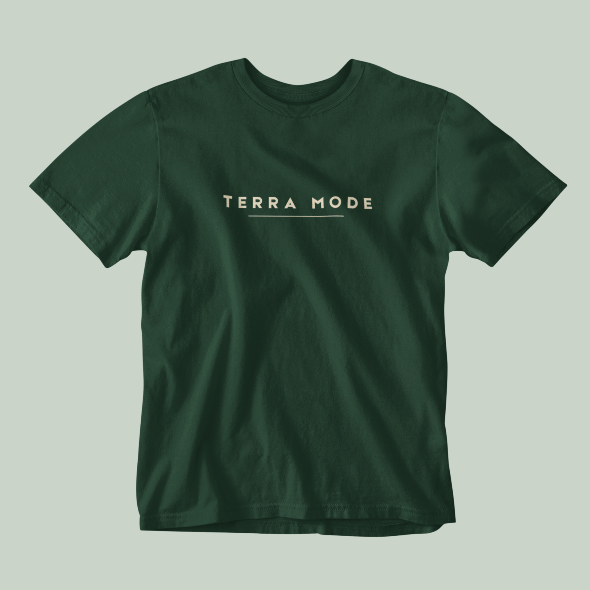 Tucktribe bottle Green t-shirt with 'Terra Mode' text on a light gray background