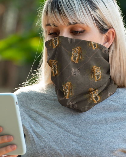woman wearing a Tiger Spirit Neck Gaiter with repeating tiger and wildlife print