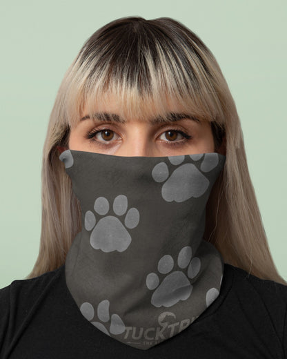 woman wearing  a tucktribe paw print wildlife neck gaiter