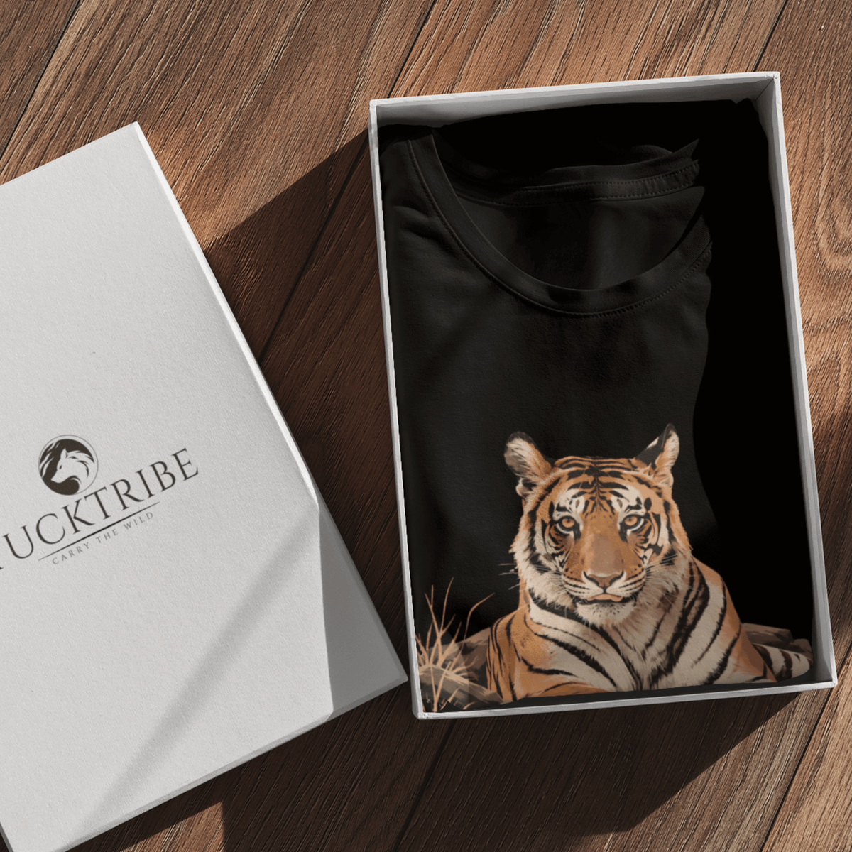 Queen of Panna Bengal tiger graphic on black unisex T-shirt by Tucktribe folded and kept in a carton box.