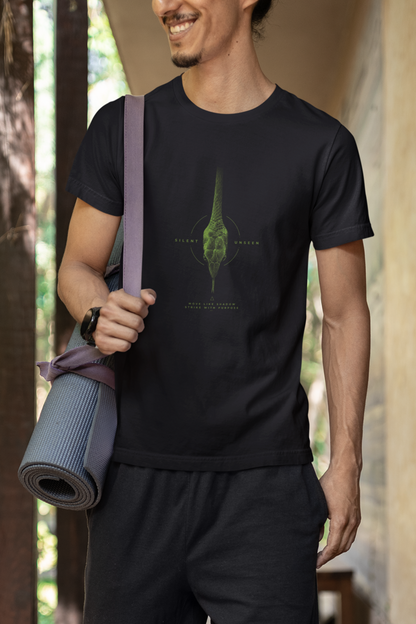 Man wearing a Black graphic T-shirt featuring detailed green vine snake artwork with Silent Unseen typography