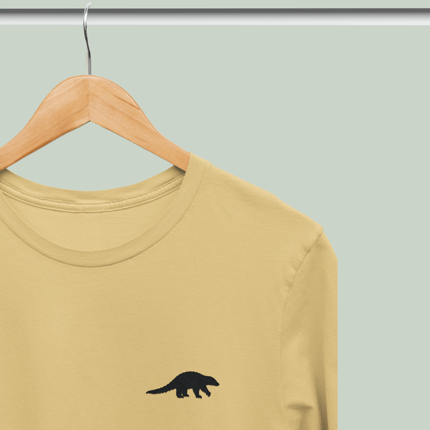 Beige Supima cotton t-shirt with embroidered Indian Pangolin wildlife design by Tucktribe