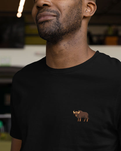 man wearing a black Supima cotton t-shirt with embroidered Indian Gaur wildlife design by Tucktribe