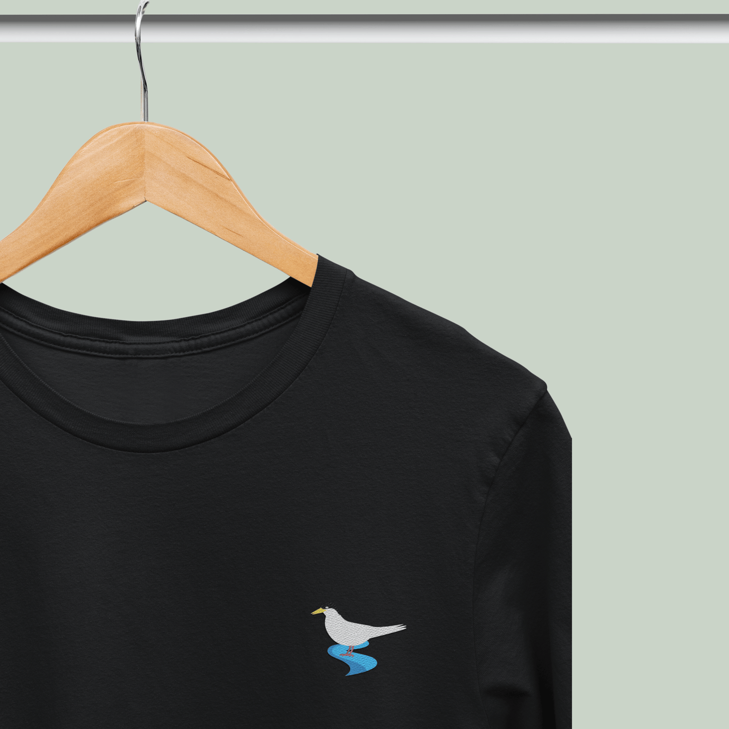 Black Supima cotton t-shirt with embroidered River Tern bird design by Tucktribe