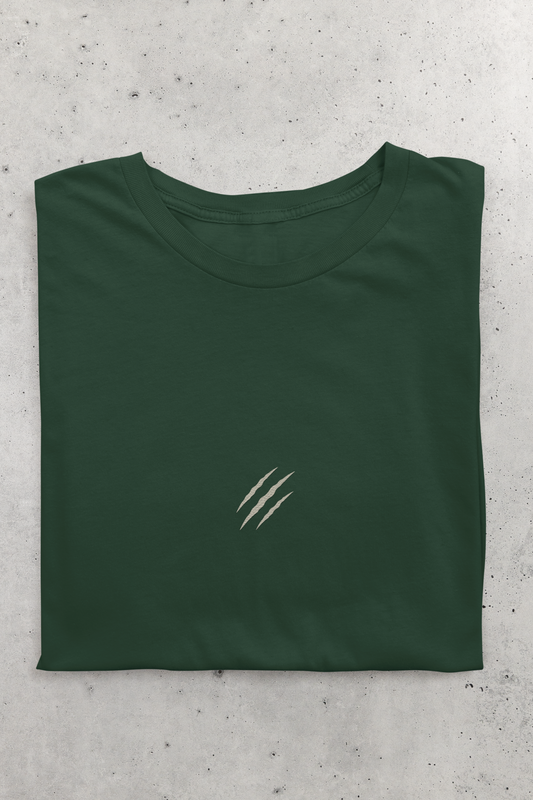 Tucktribe bottle Green t-shirt with a claw scratch embroidery on a gray concrete surface