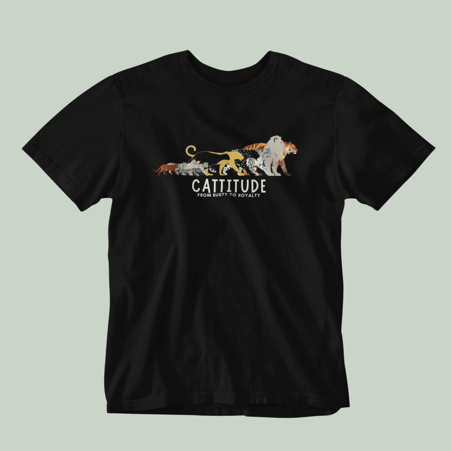 Black Tucktribe t-shirt with cat-themed graphic and 'Cattitude' text on a light green background