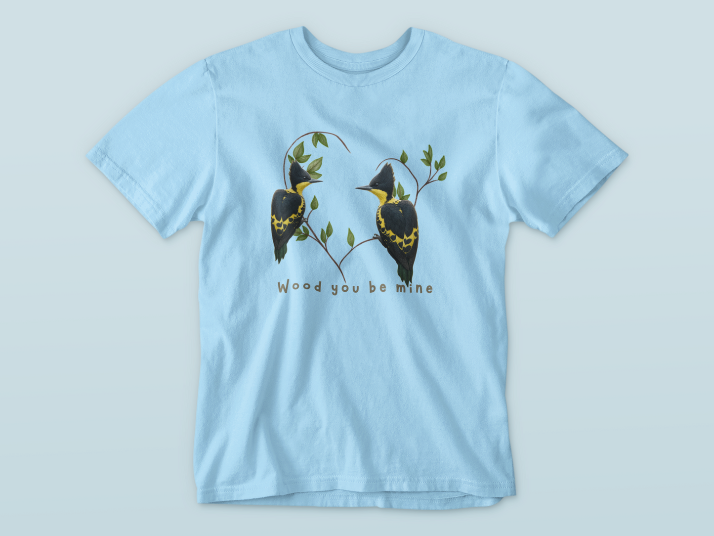 Light blue t-shirt with bird design and text on a light gray background