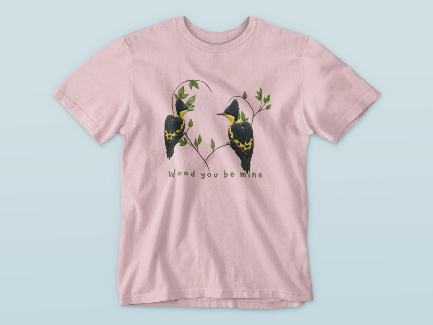 Pink t-shirt with bird design and text on a light blue background