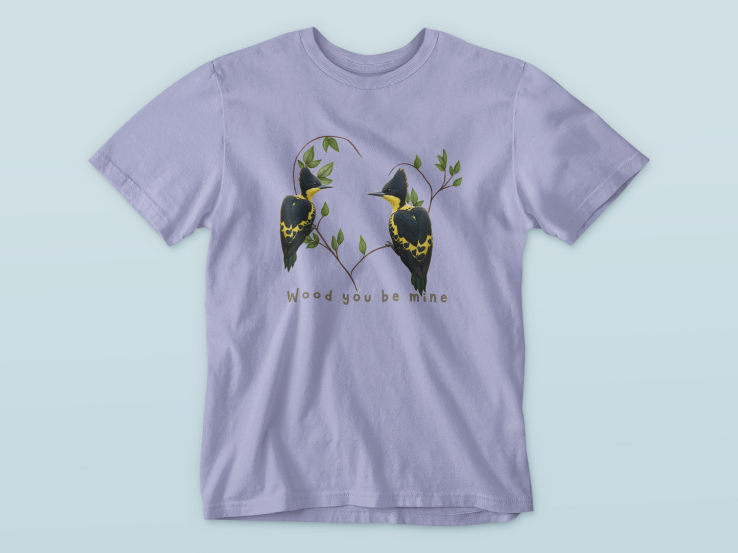 lavender t-shirt with bird design and text on a light blue background